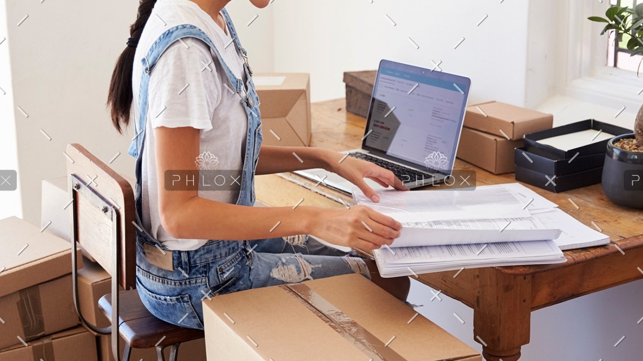 woman-running-business-from-home-working-on-PCZKTN9